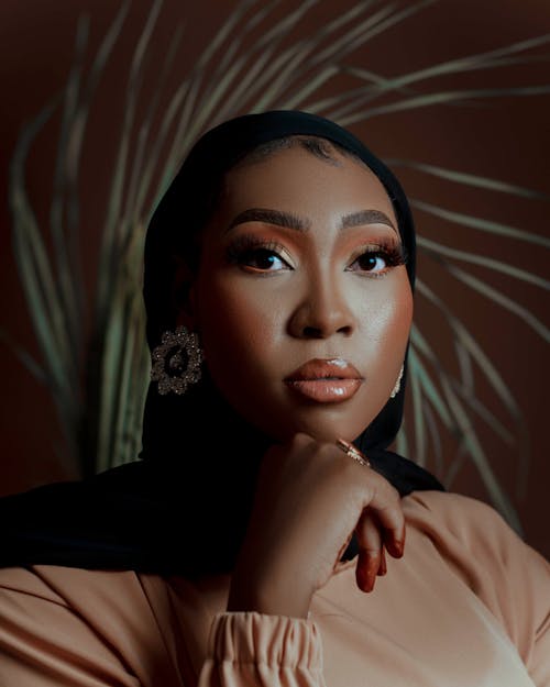 Studio Shot of an Elegant Woman in a Hijab Wearing a Glamour Makeup Look