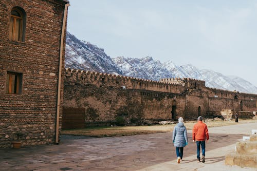 Couple Walking at Fortification in Mtskheta Town