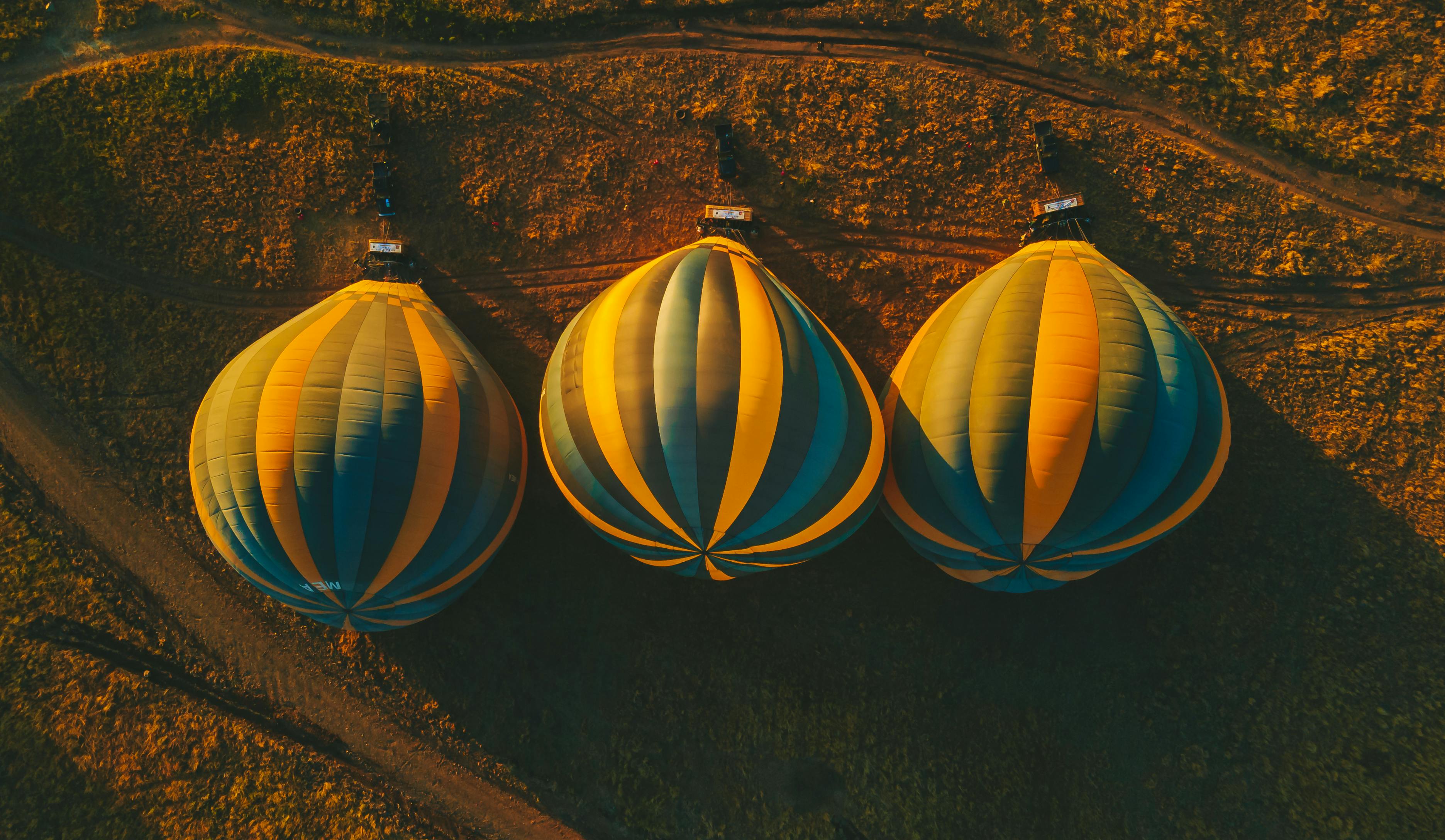 Stunning aerial view of hot air balloons ready for adventure in the savannah.