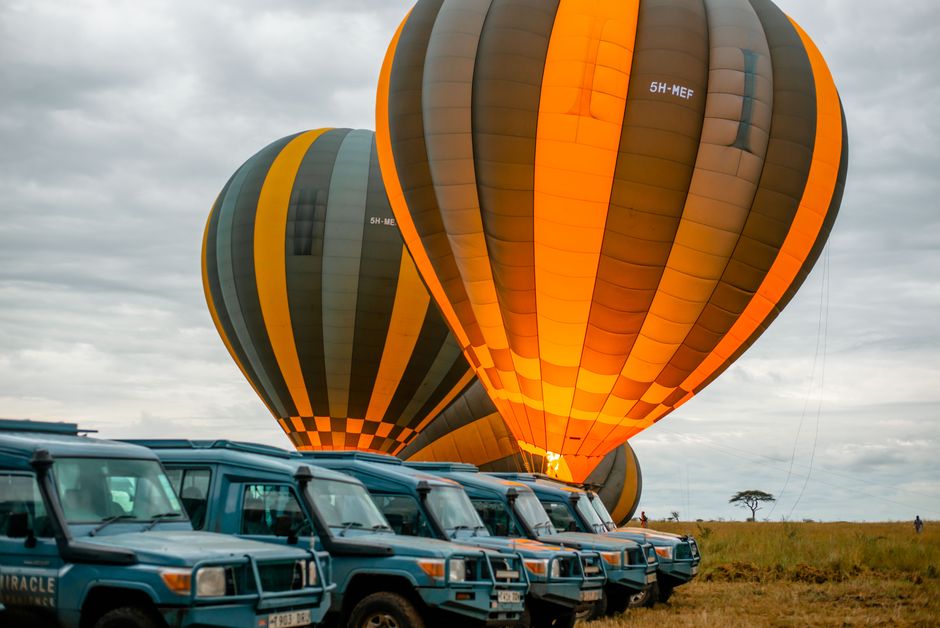 Captivating dawn scene of hot air balloons readying for launch during a safari in Tarangire National Park, Tanzania.