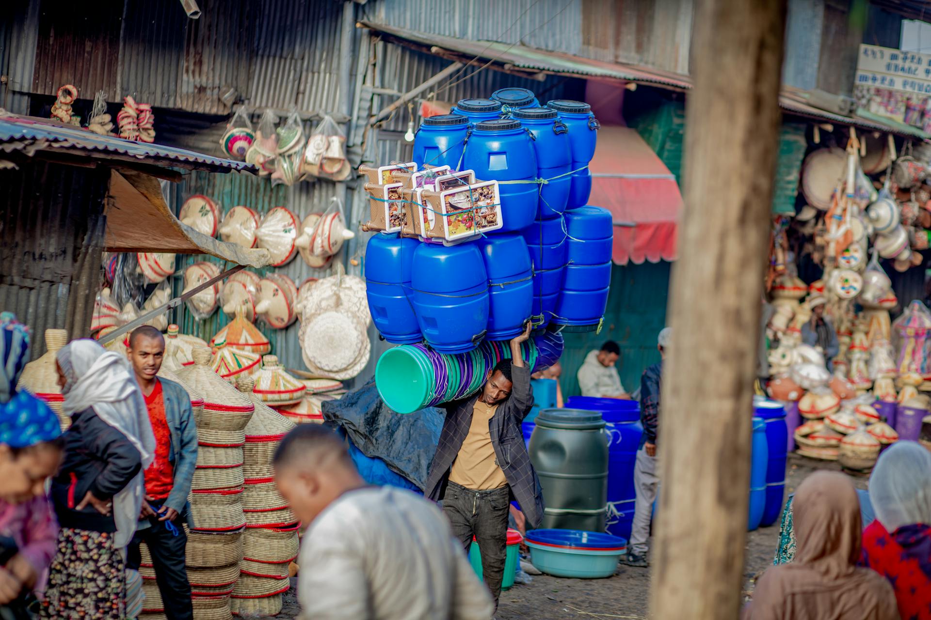 A Man Carrying Barrels