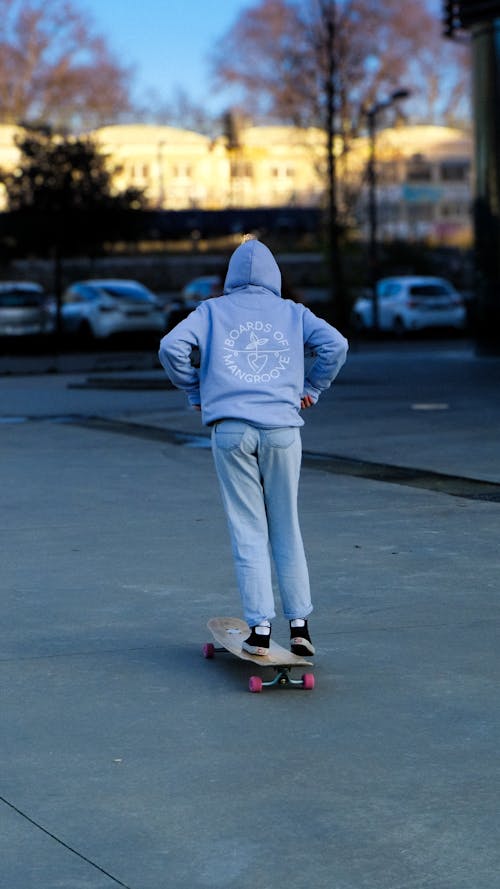Skater is Riding Skateboard on Street