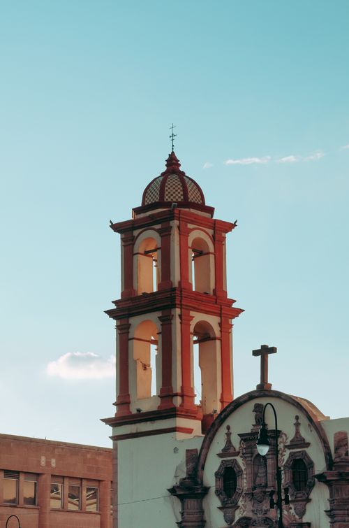 Free Vertical view of the iconic Capilla de Loreto tower against a clear sky in San Luis Potosi, Mexico. Stock Photo
