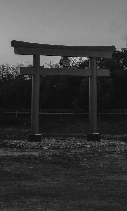 A black and white photo of a tori gate