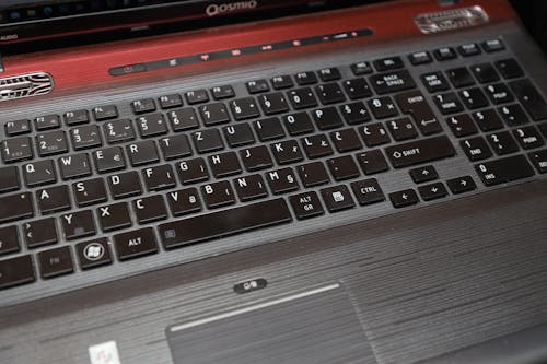 A close up of a laptop computer with a keyboard