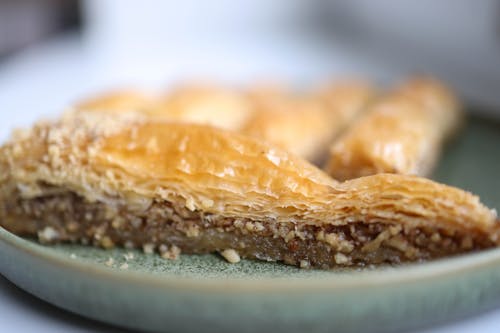 A plate with a piece of baklava on it