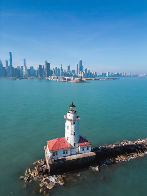Aerial View of the Chicago Harbor Light and Chicago Skyline in the Background