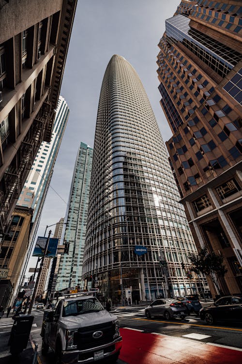 A tall building with a large glass window in the middle