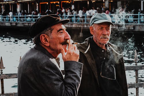 Old Men Smoking on Bridge