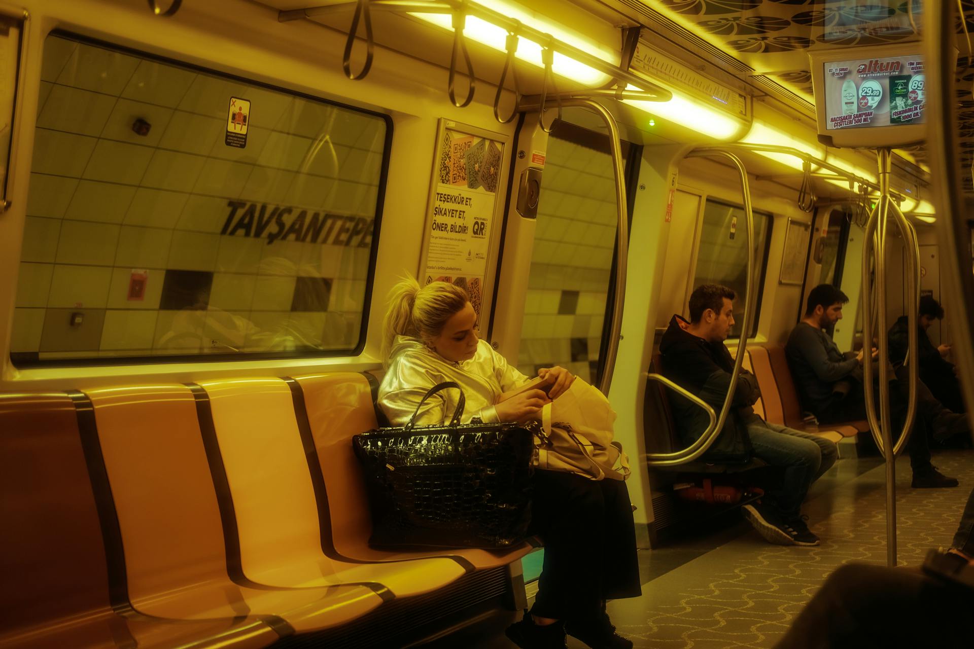 Woman and Men Sitting on Metro Train in Istanbul