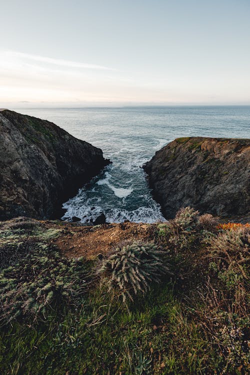 Bay near Rocks on Seashore