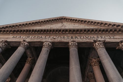Free A low angle view of the Pantheon in Rome, showcasing its iconic columns and ancient architecture. Stock Photo