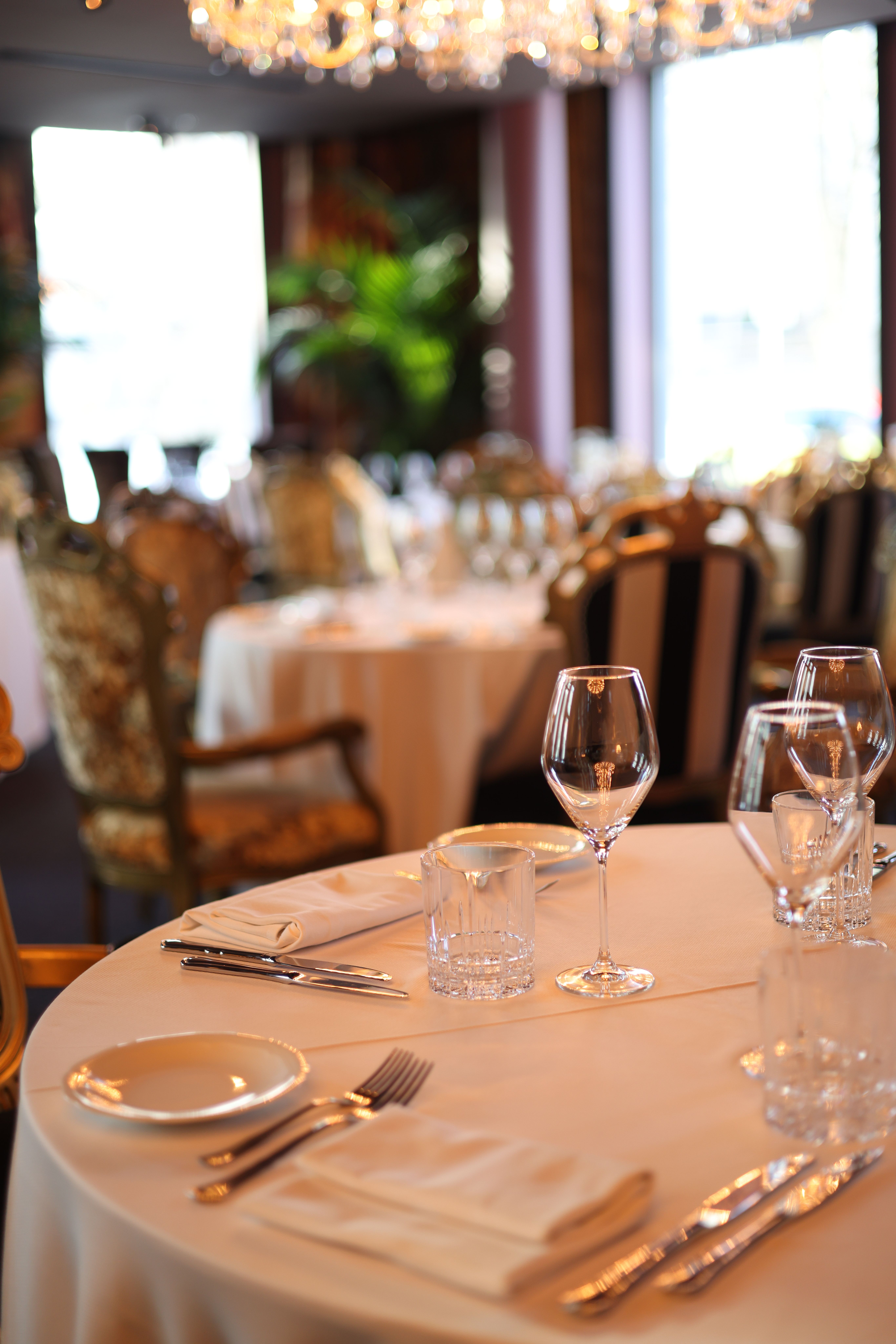 Fine-dining table setting with glassware and considered detail