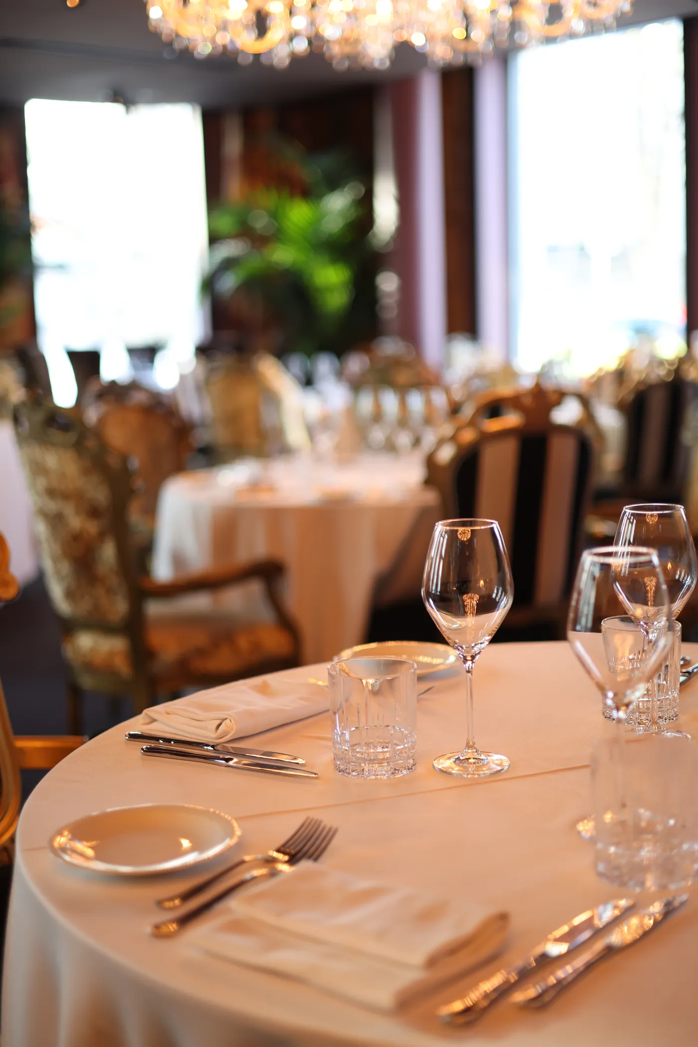 Fine-dining table setting with glassware and considered detail