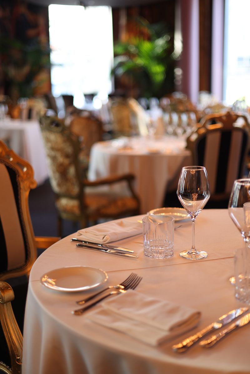 Upscale dining room with elegant table settings