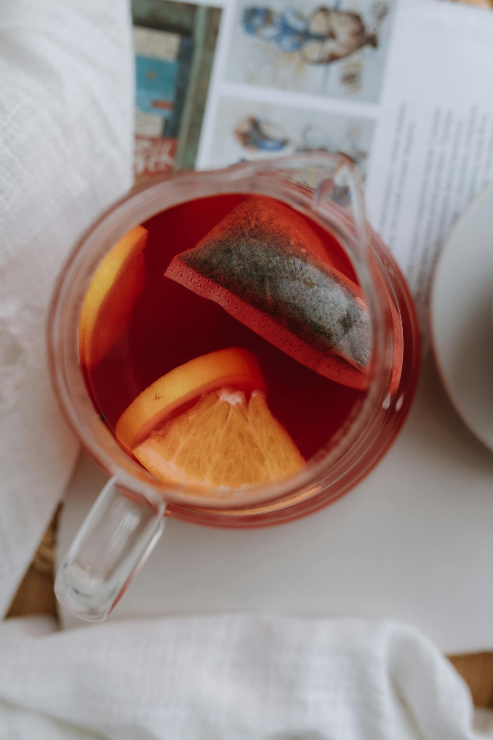 Woman Filling Tea in Cup on Table · Free Stock Photo