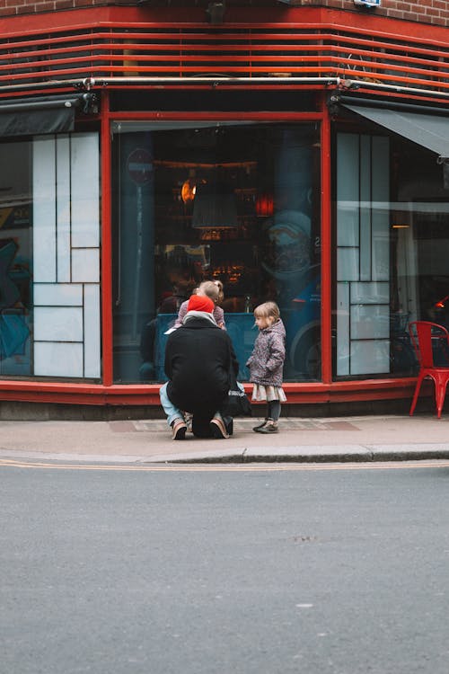 A Family in front of a Restaurant with Red Architecture in Dublin