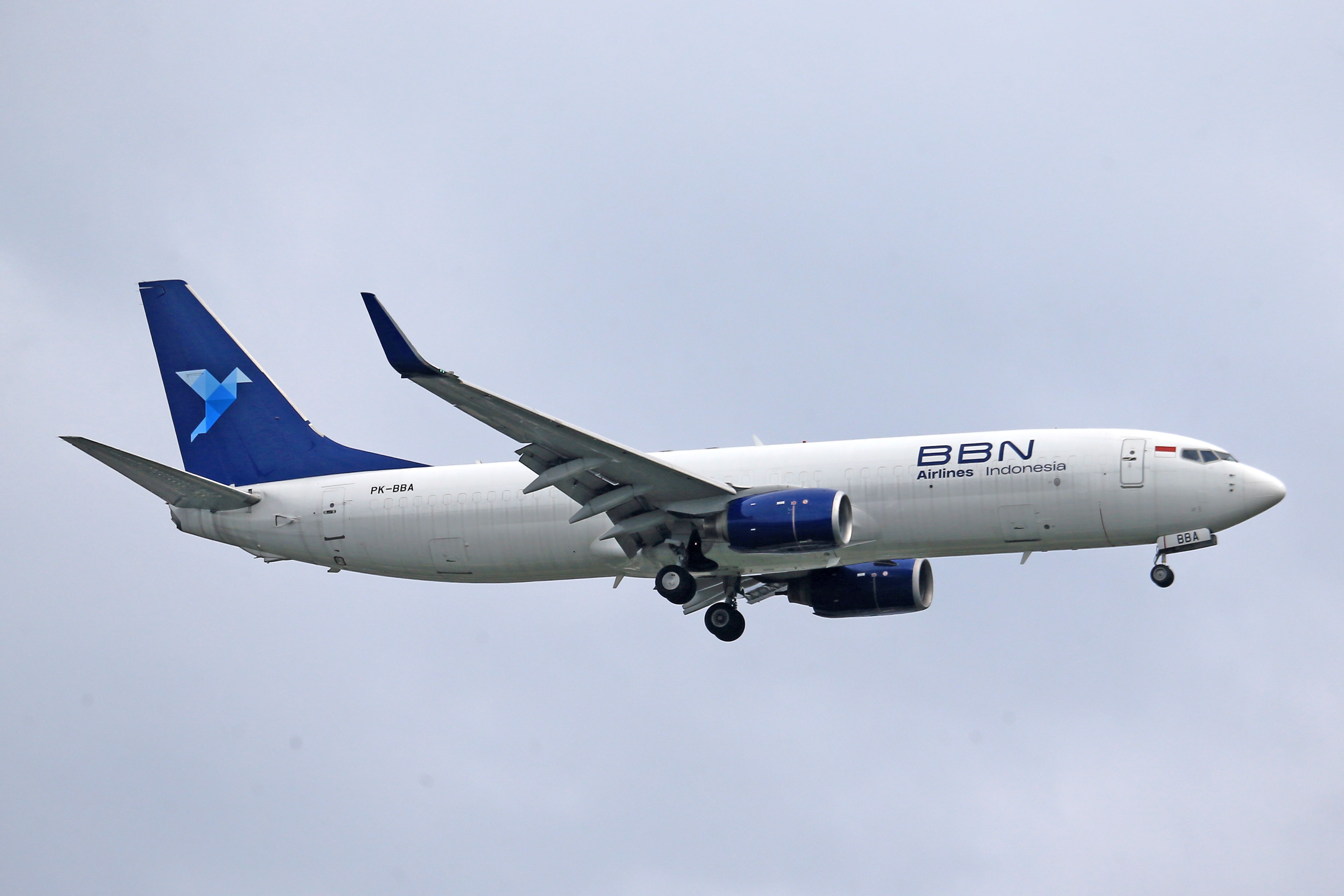 View of BBN Airlines Indonesia Airliner Flying against Cloudy Sky
