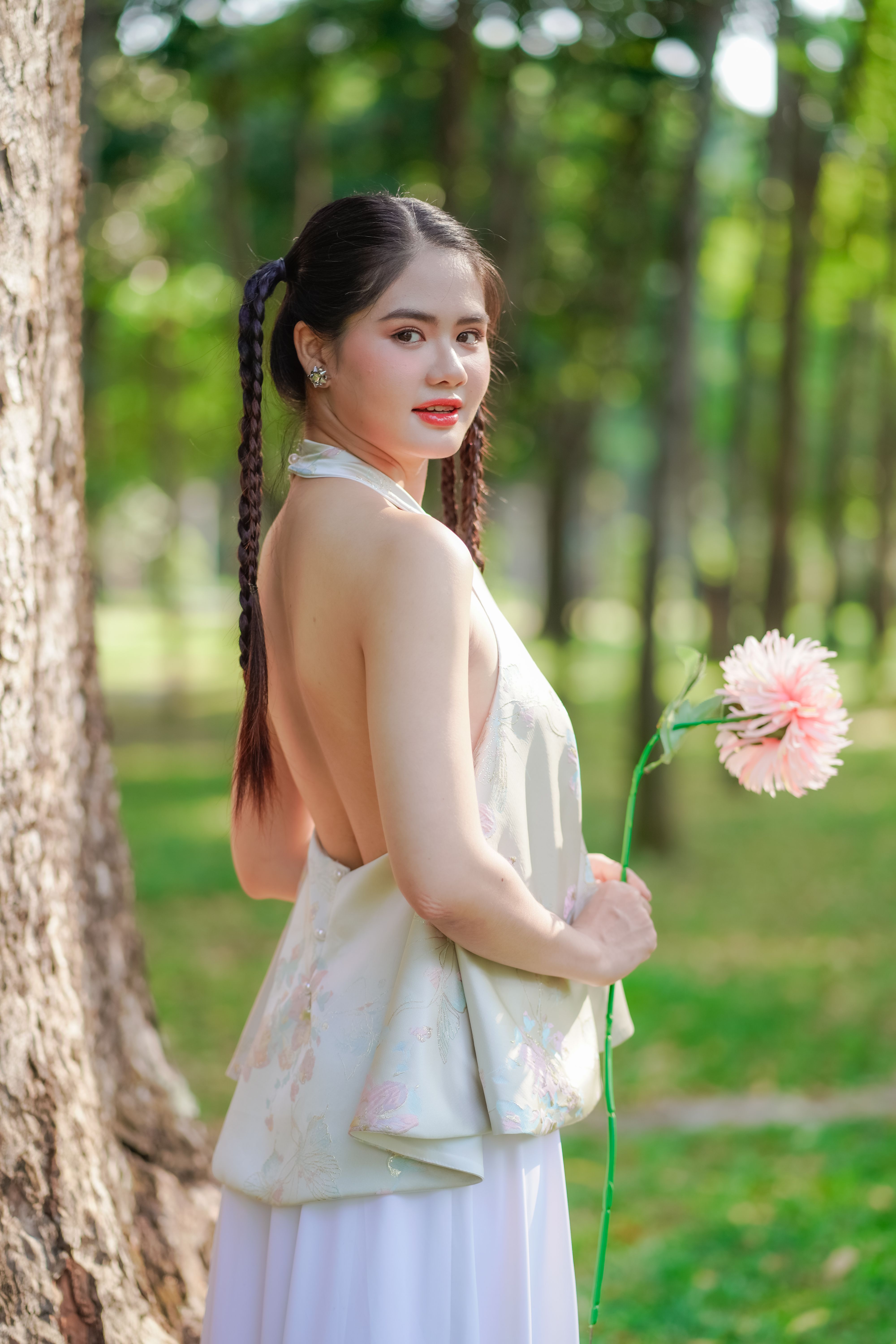sachin and babi light blue dress Pretty Girl with Traditional Backless Dress Holding a Pink Flower · Free  Stock Photo