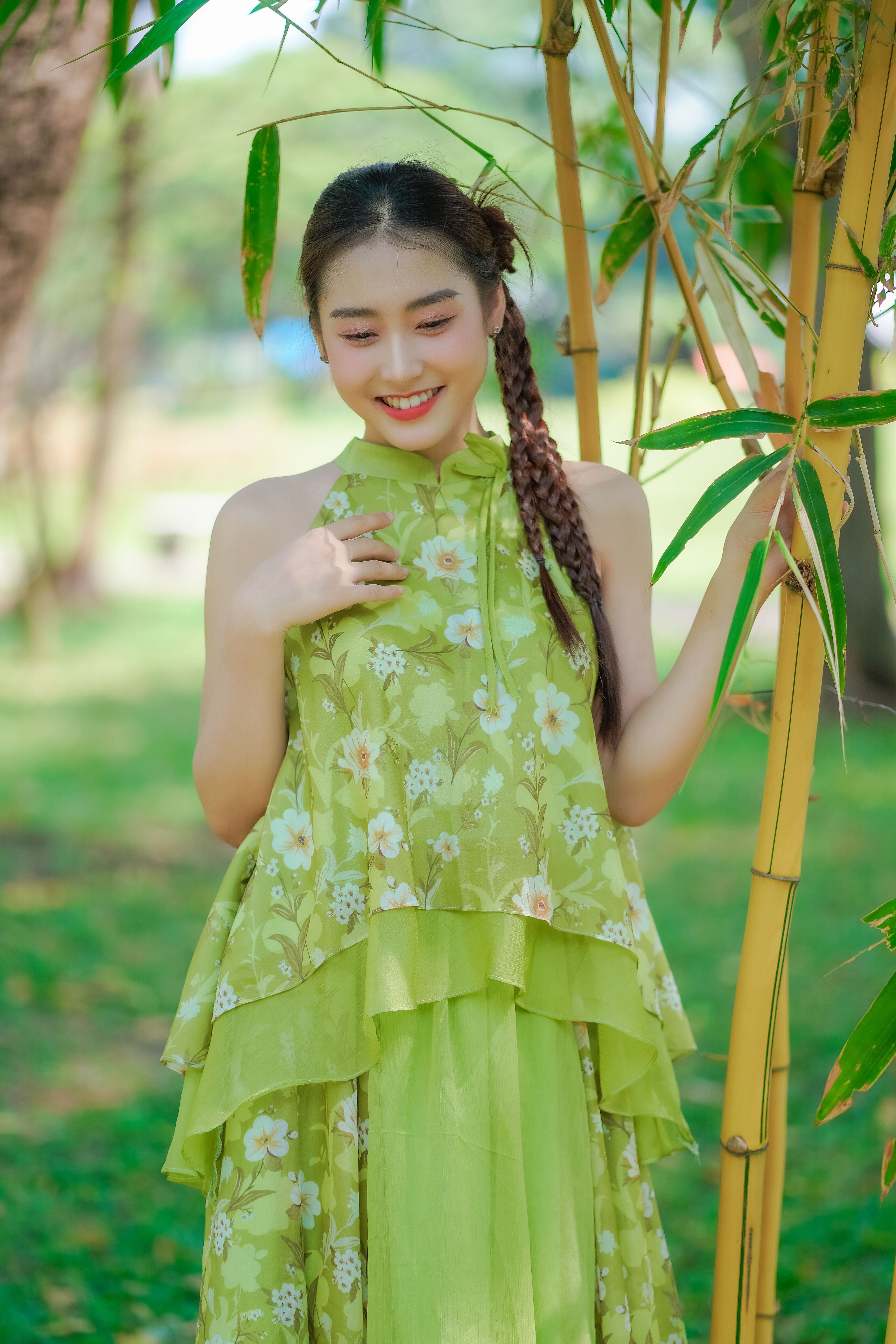 Young Woman in an Elegant Dress Posing in a Park  Free Stock Photo