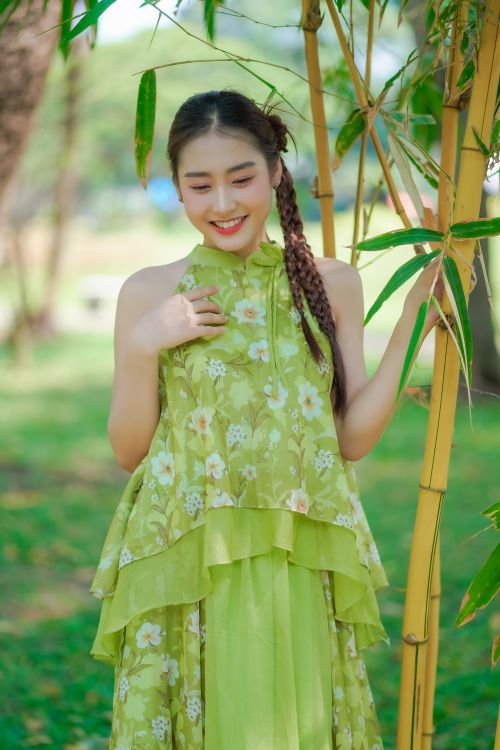 Young Woman in an Elegant Dress Posing in a Park Free Stock Photo Young Woman in an Elegant Dress Posing in a Park Free Stock Photo