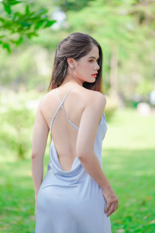 Back View of Woman in White Dress