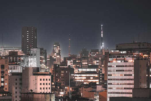 Stunning nighttime skyline of São Paulo, showcasing illuminated modern architecture and urban landscape.
