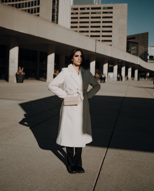 Sunlit Brunette Woman on Pavement