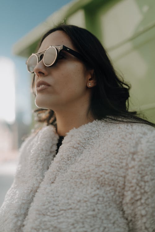 Woman in Fluffy Jacket and Sunglasses