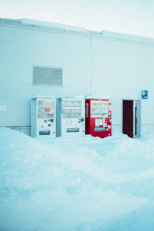 A vending machine and a snow covered building