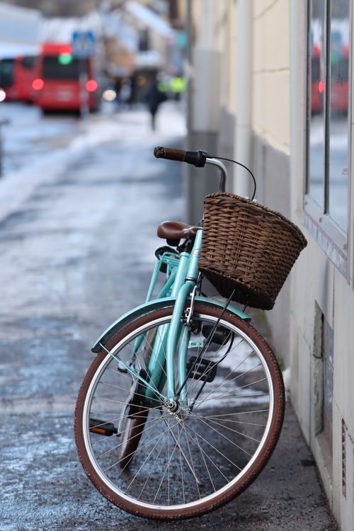 Free Charming vintage bicycle with a basket, parked on a snowy street in Jönköping, Sweden. Stock Photo