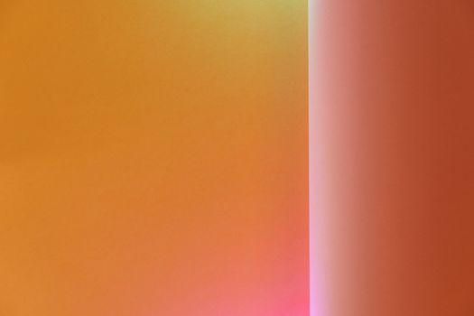 Abstract gradient background with warm colors blending from orange to red tones.