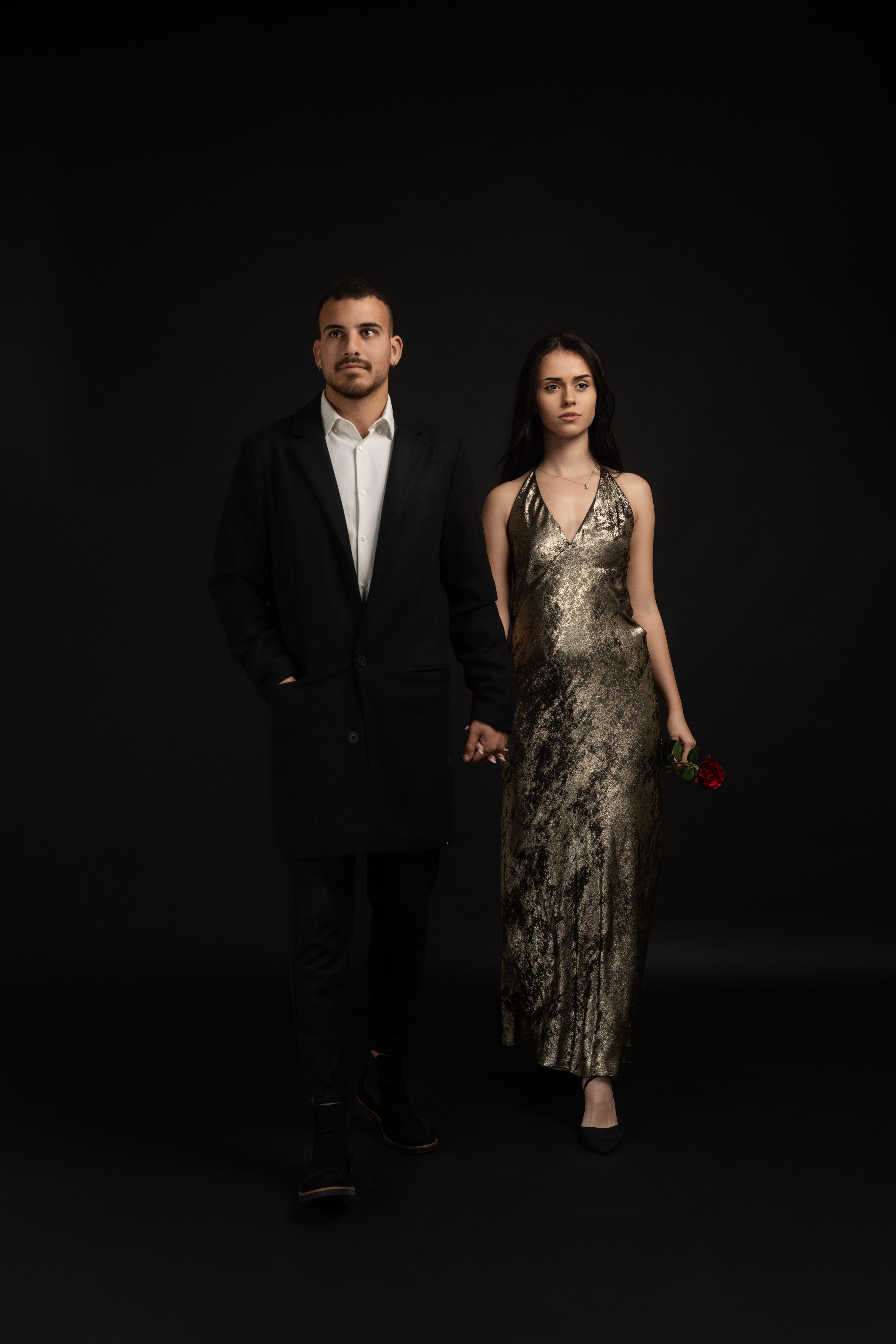A man and woman in formal clothing standing next to each other · Free ...