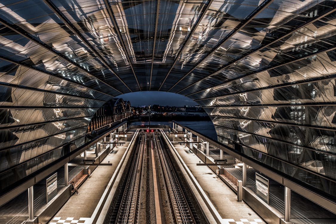 Symmetrical View of Platforms at the Elbbrucken Station in Hamburg, Germany at Night 