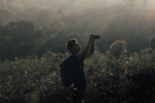 Free Photographer Working on Meadow Stock Photo