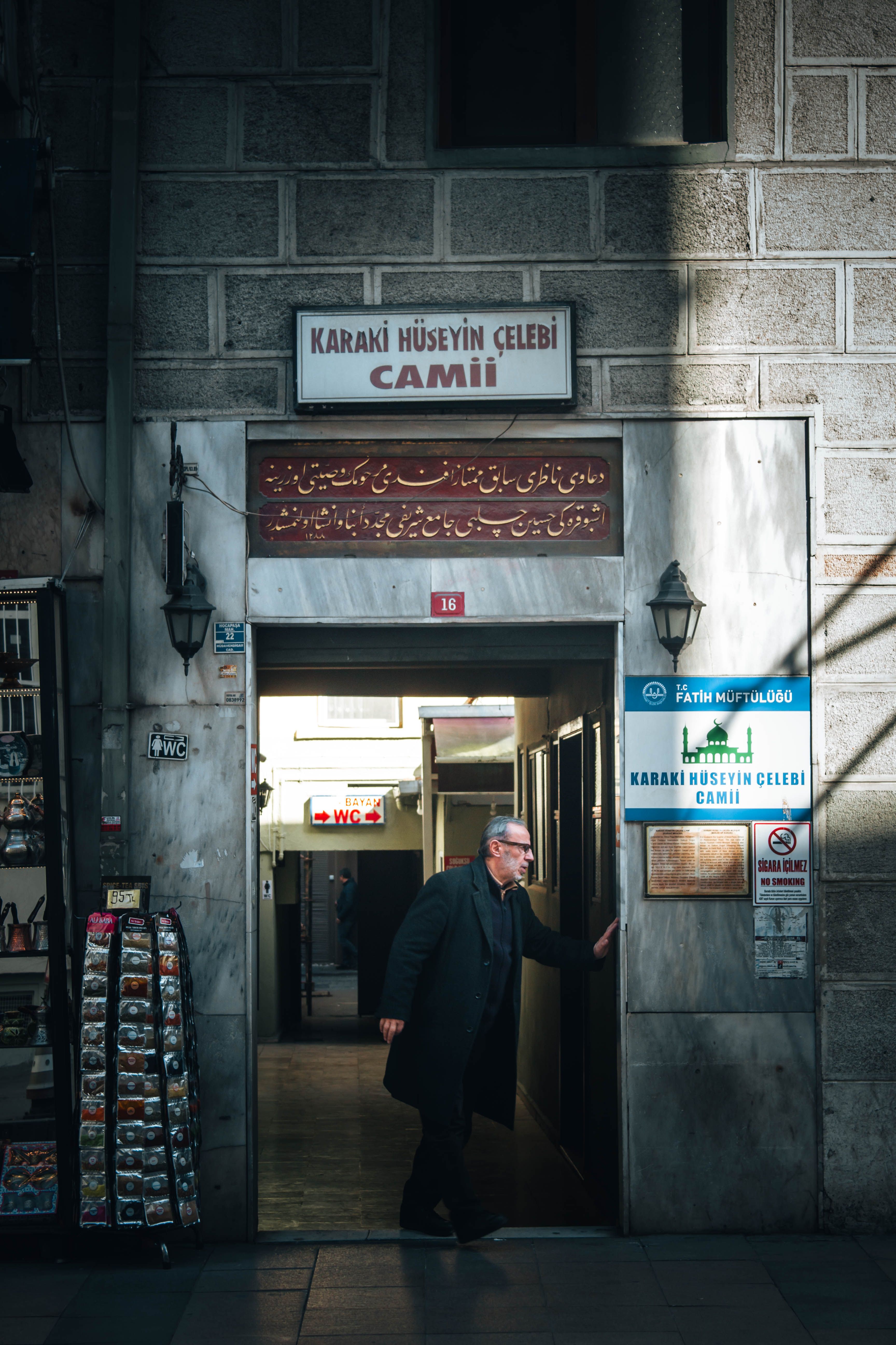A man is entering the Karaköy Hüseyin Çelebi Mosque in Istanbul, Turkey.