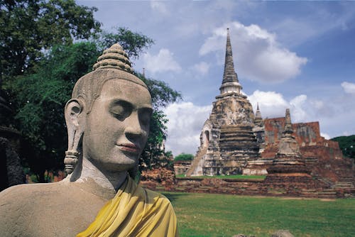 A Statue in Front of the Wat Phra Si Sanphet Temple in Thailand 