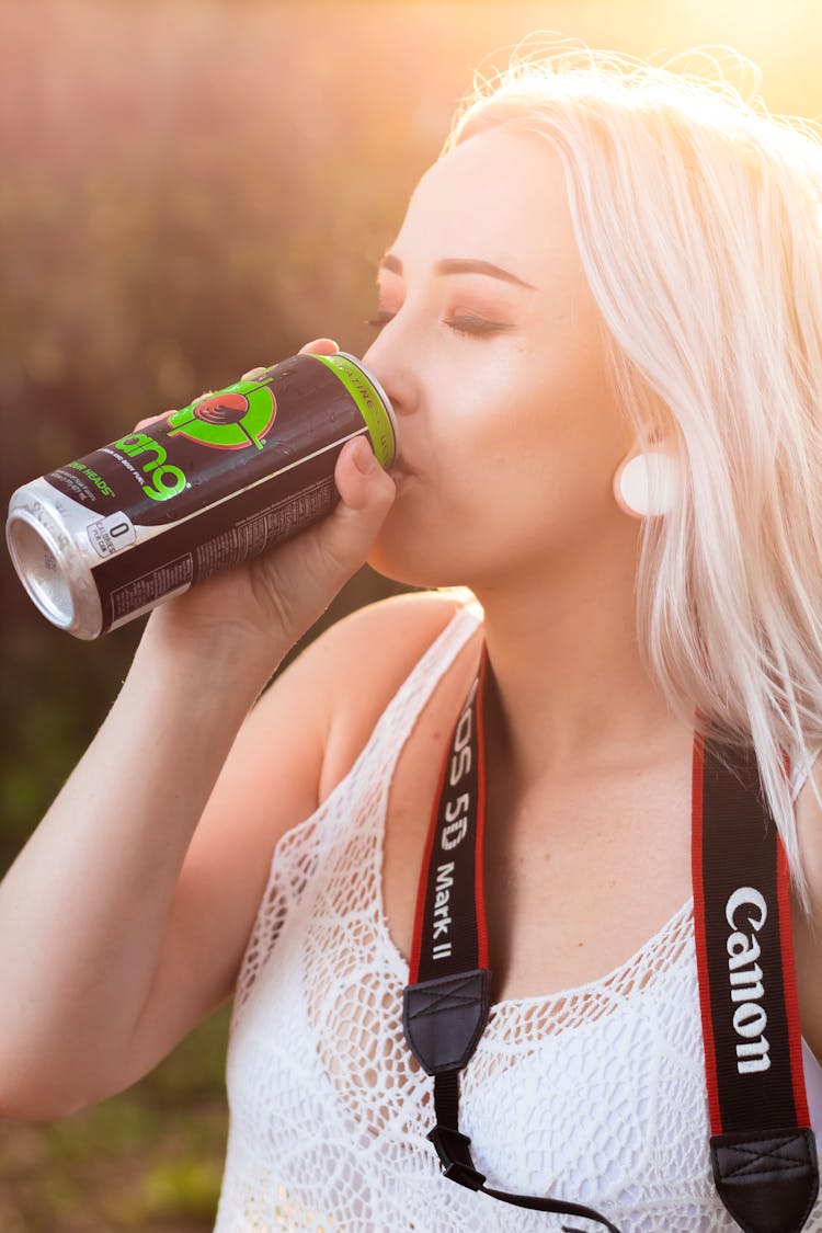 Woman Drinking Tin Can