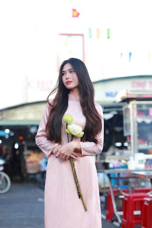 Woman in Traditional Dress and with Flowers