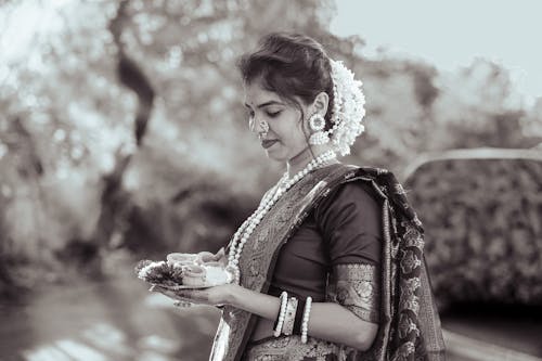 Woman in Traditional Clothing and with Jewelry in Black and White