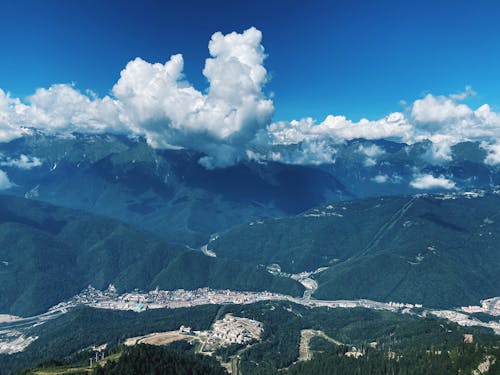 Cloud over Mountains and Town in Valley