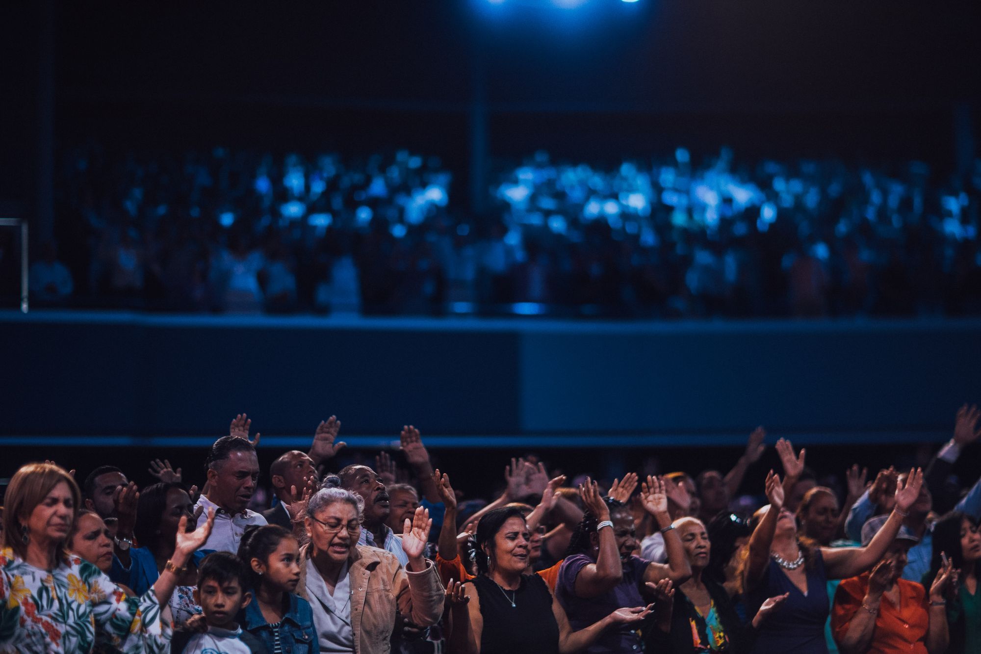Hands raised in worship and giving