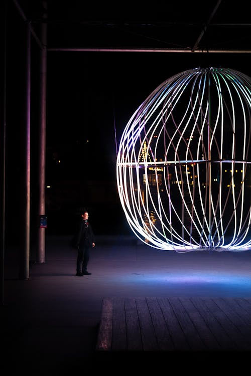 Man looking at light art in Copenhagen 