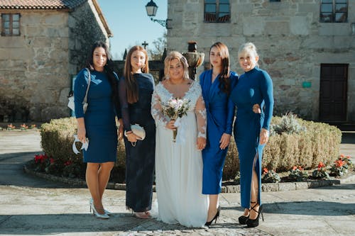 Bride and her bridesmaids in blue dresses