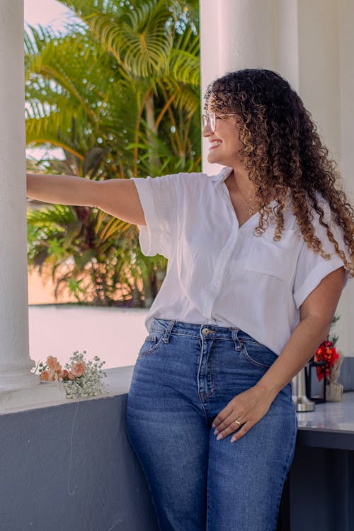 Portrait of Smiling Woman in White Shirt