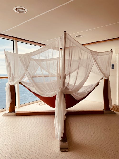 A hammock is set up in the middle of a room