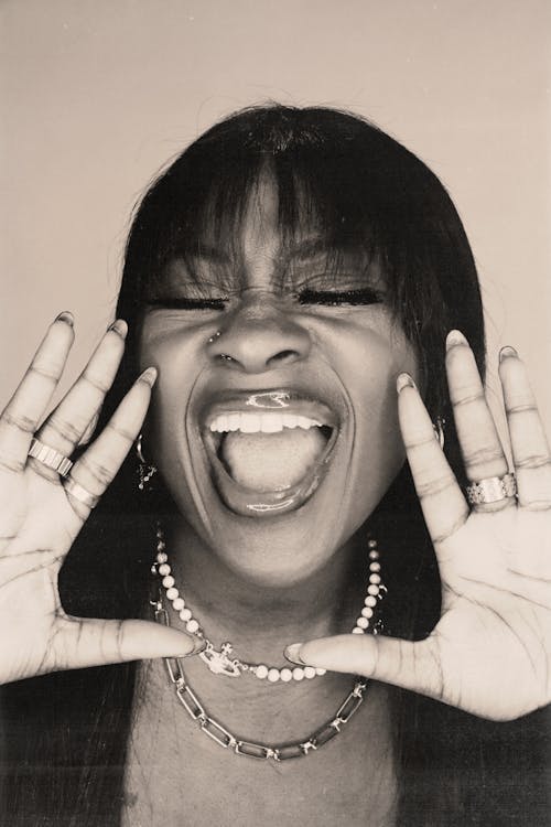 A black and white photo of a woman making a funny face