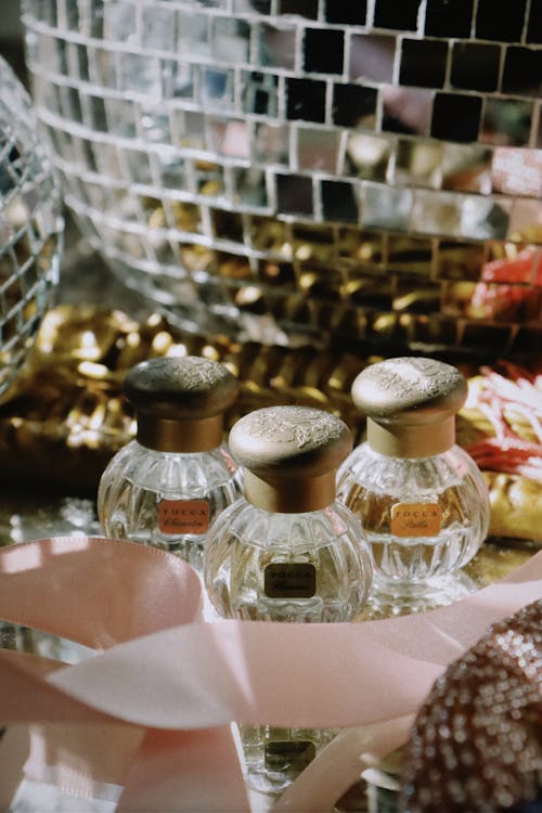 Perfumes in Front of a Disco Ball 