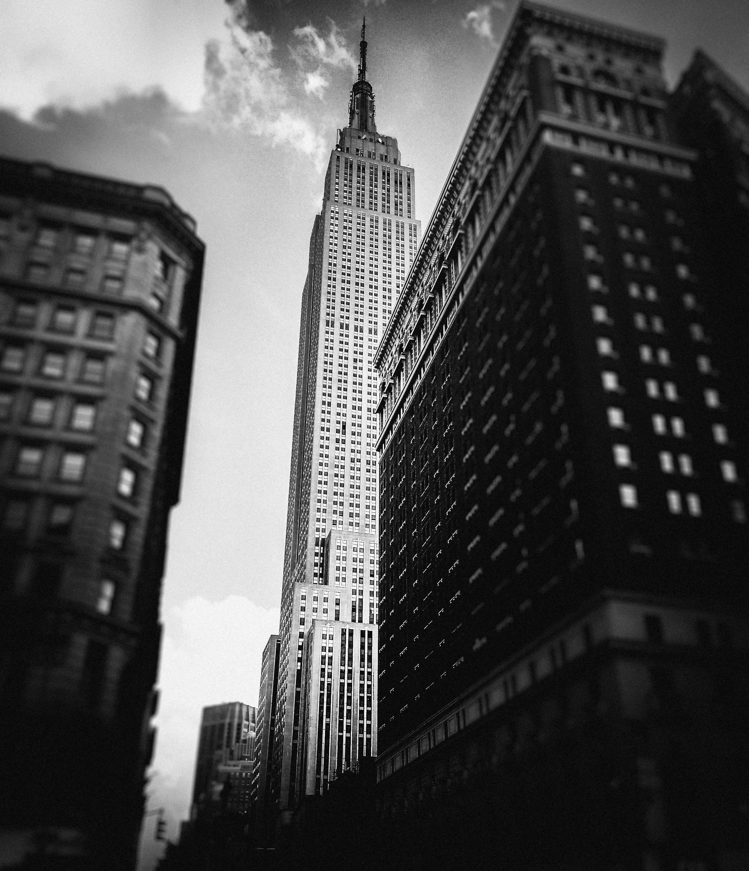 grayscale low angle photo of high rise buildings