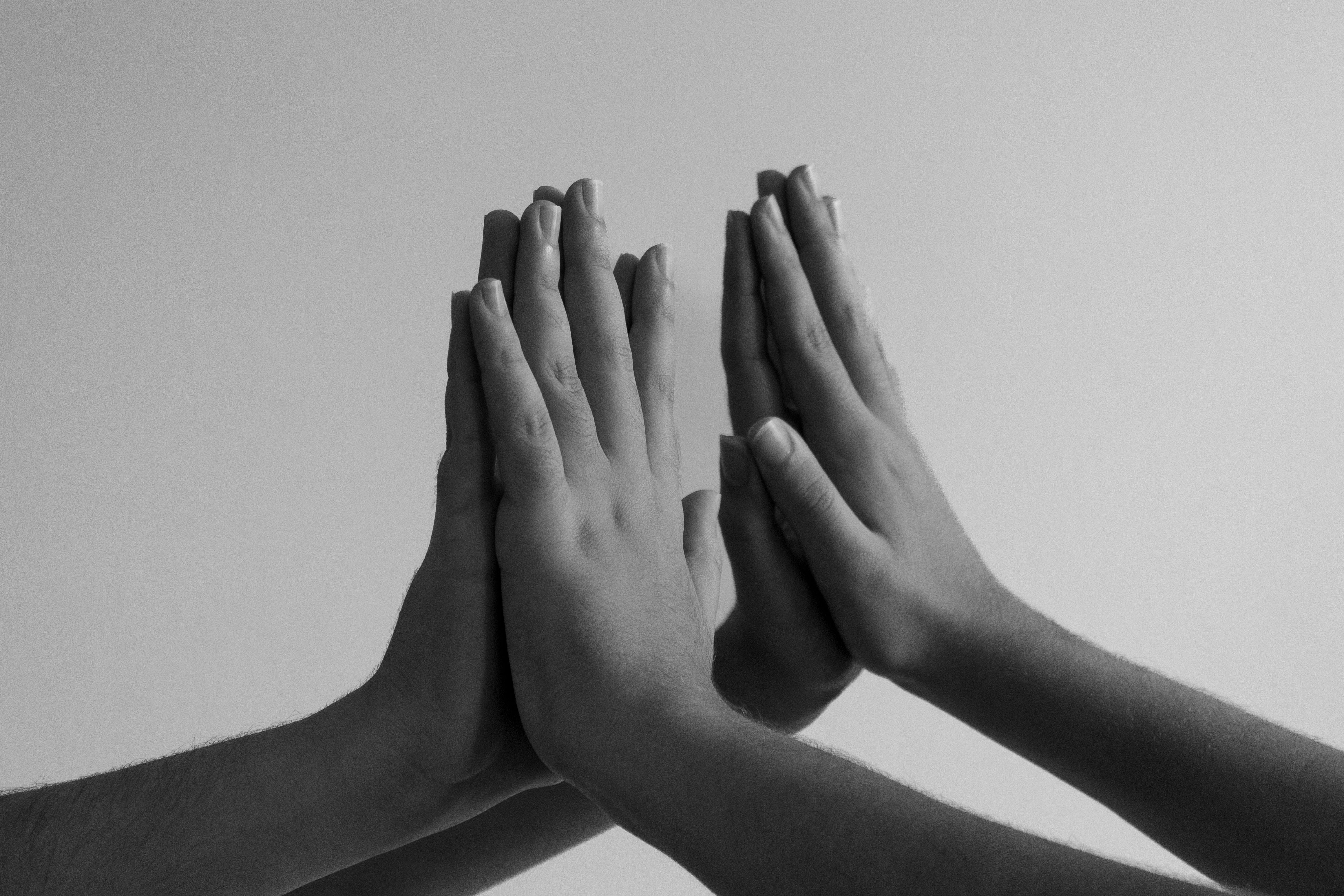 Black and White Photo of Children Touching Hands · Free Stock Photo